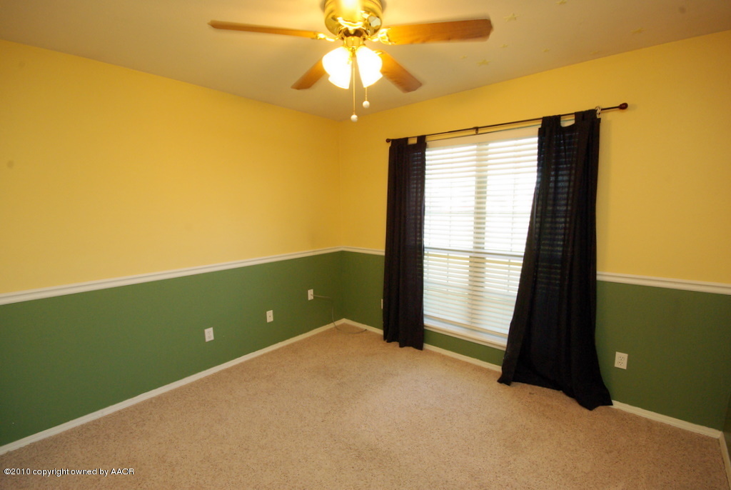 5200 Capulin Lane Amarillo, TX 79110 - Photo 8 of 8 a view of an empty room with a window