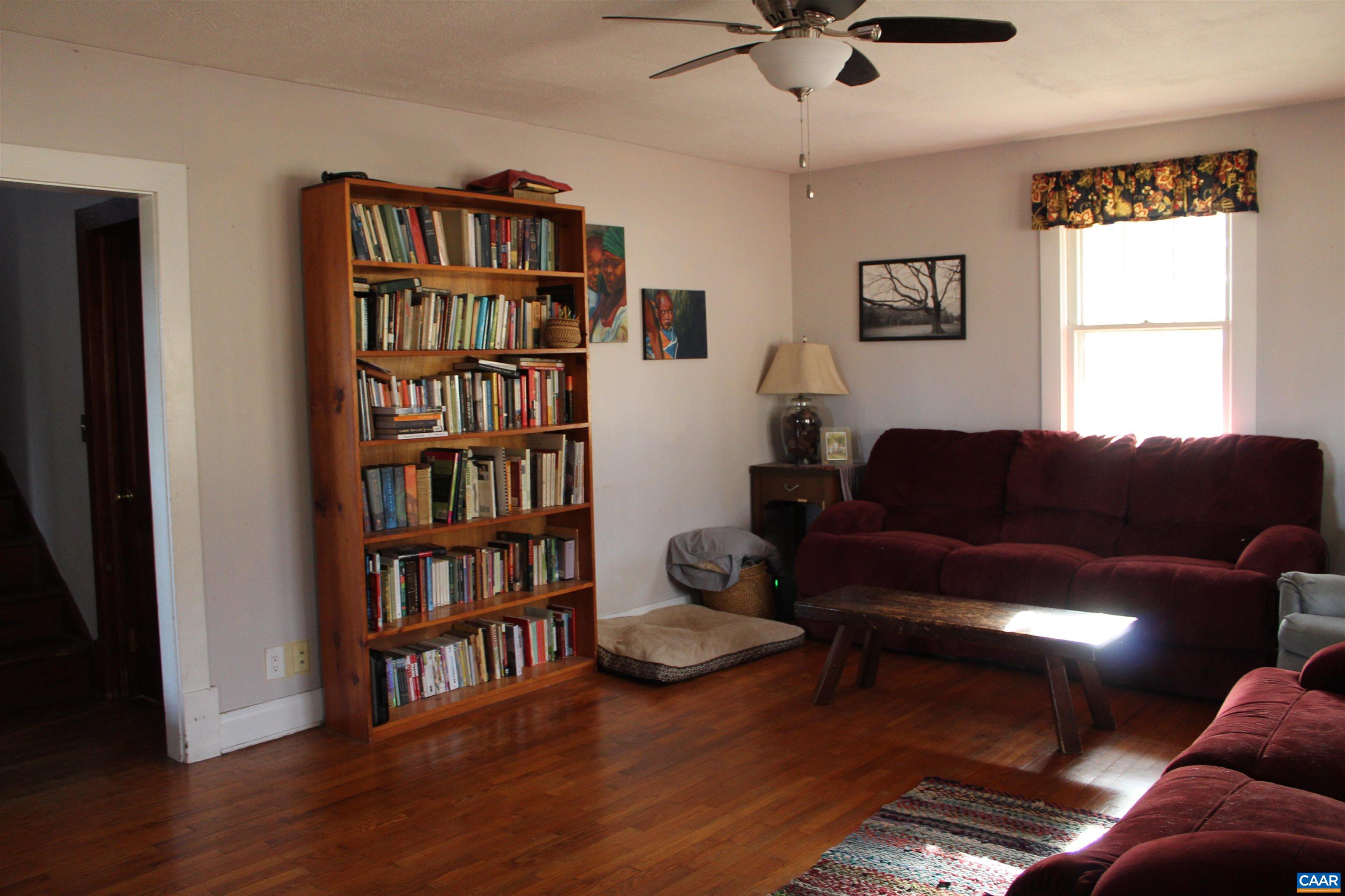 184 Flat Woods Road Amherst, VA 24521 - Photo 12 of 21 a living room with furniture and a book shelf
