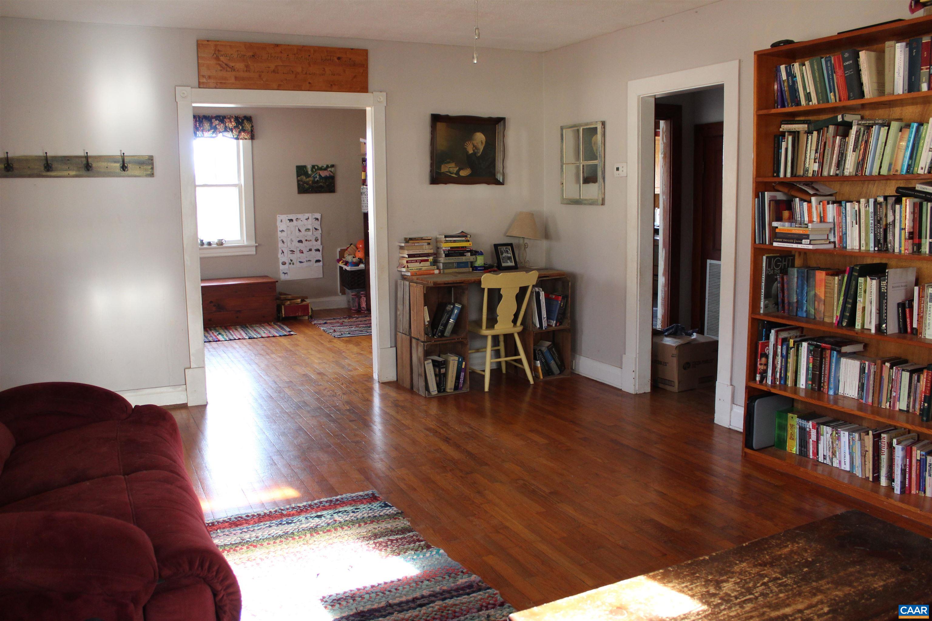 184 Flat Woods Road Amherst, VA 24521 - Photo 15 of 21 a living room with furniture and a book shelf