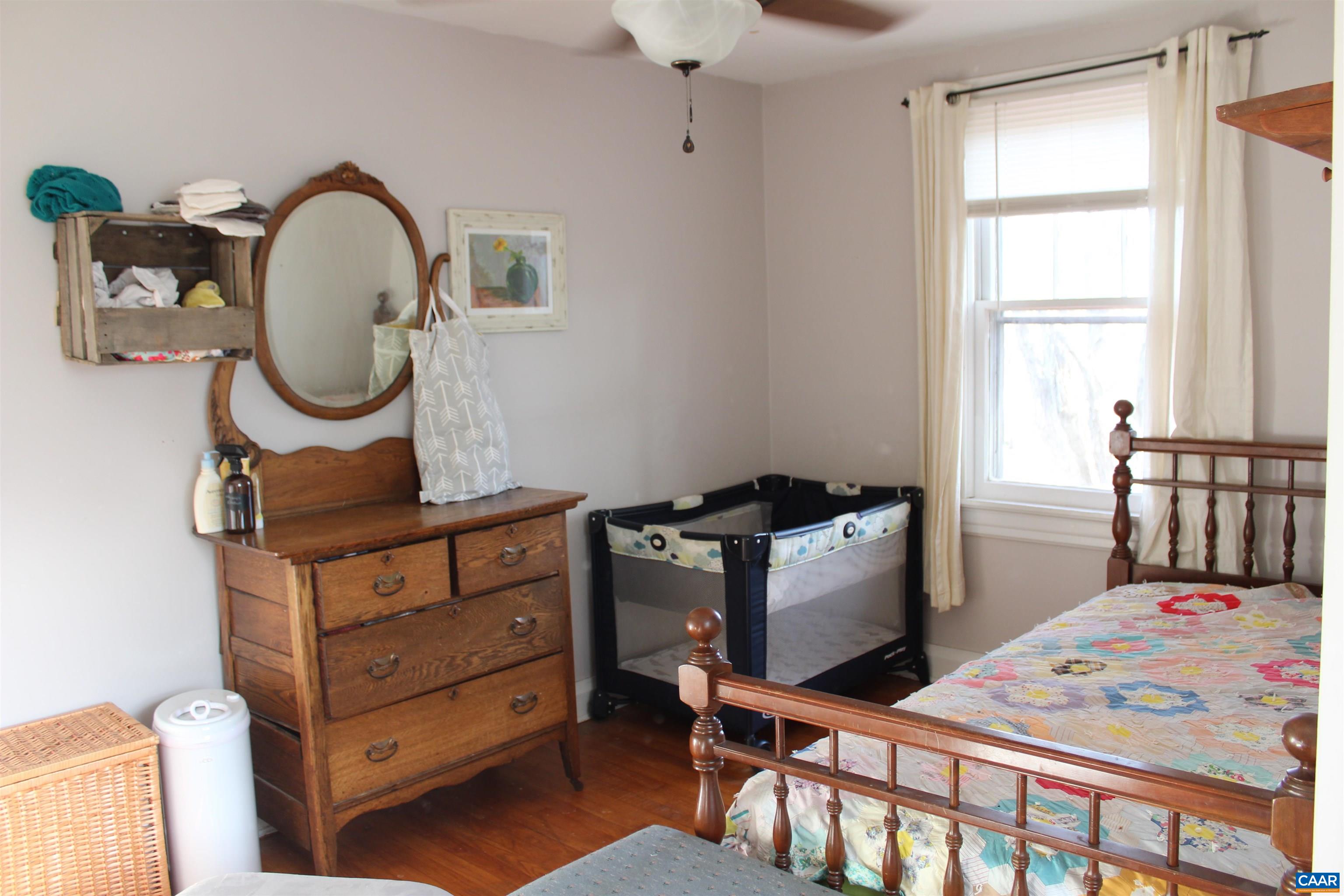 184 Flat Woods Road Amherst, VA 24521 - Photo 19 of 21 a bed room with a bed and a table