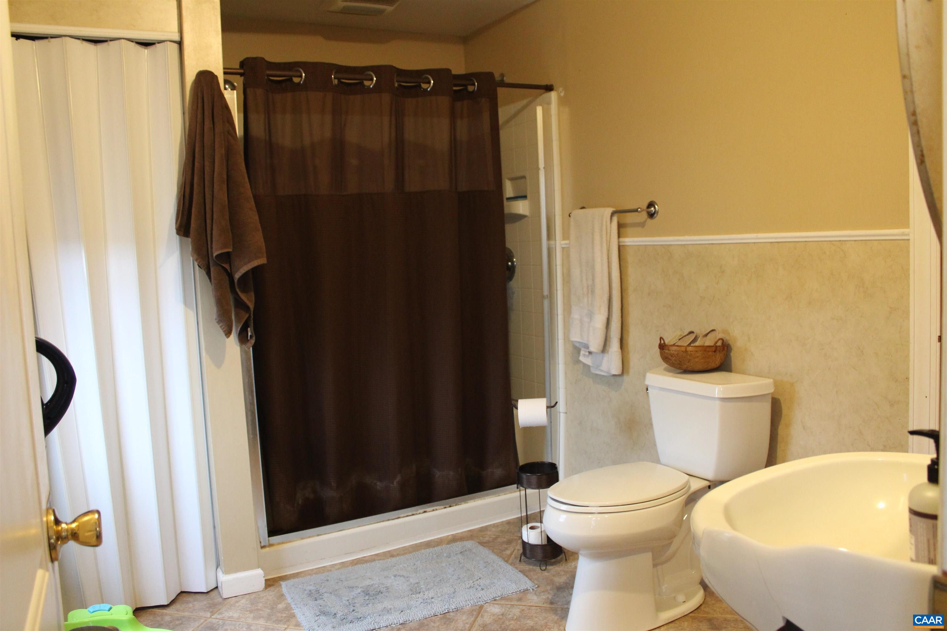 184 Flat Woods Road Amherst, VA 24521 - Photo 21 of 21 a bathroom with a sink and a toilet