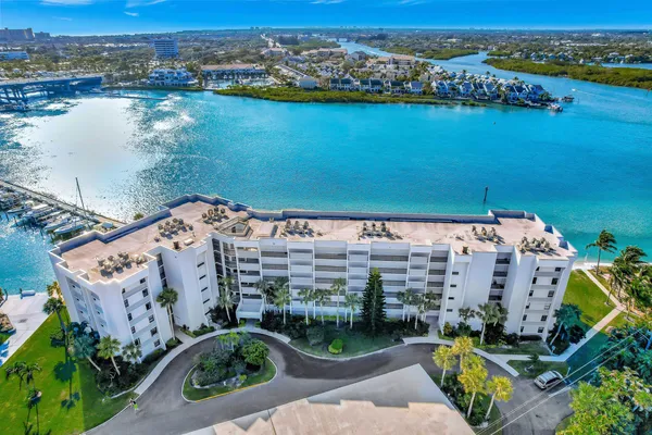 an aerial view of a city with ocean view