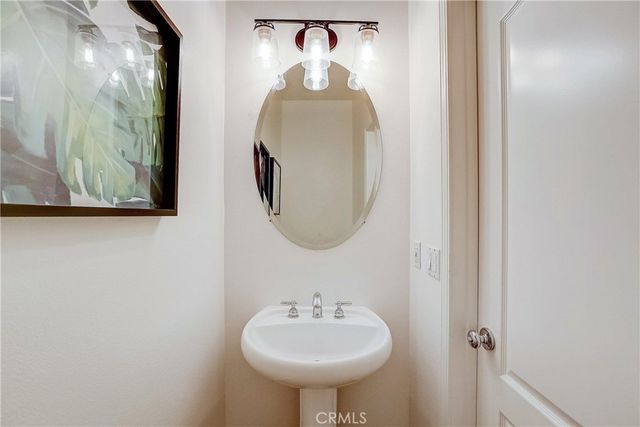 a bedroom with a bed and a lamp