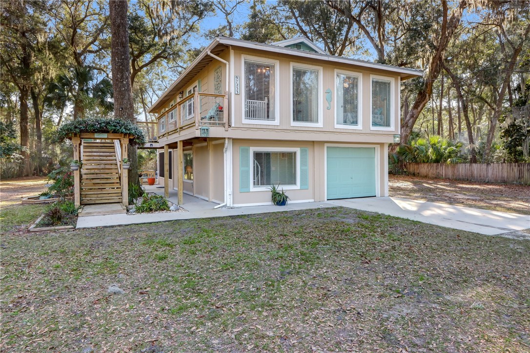 a front view of a house with garage