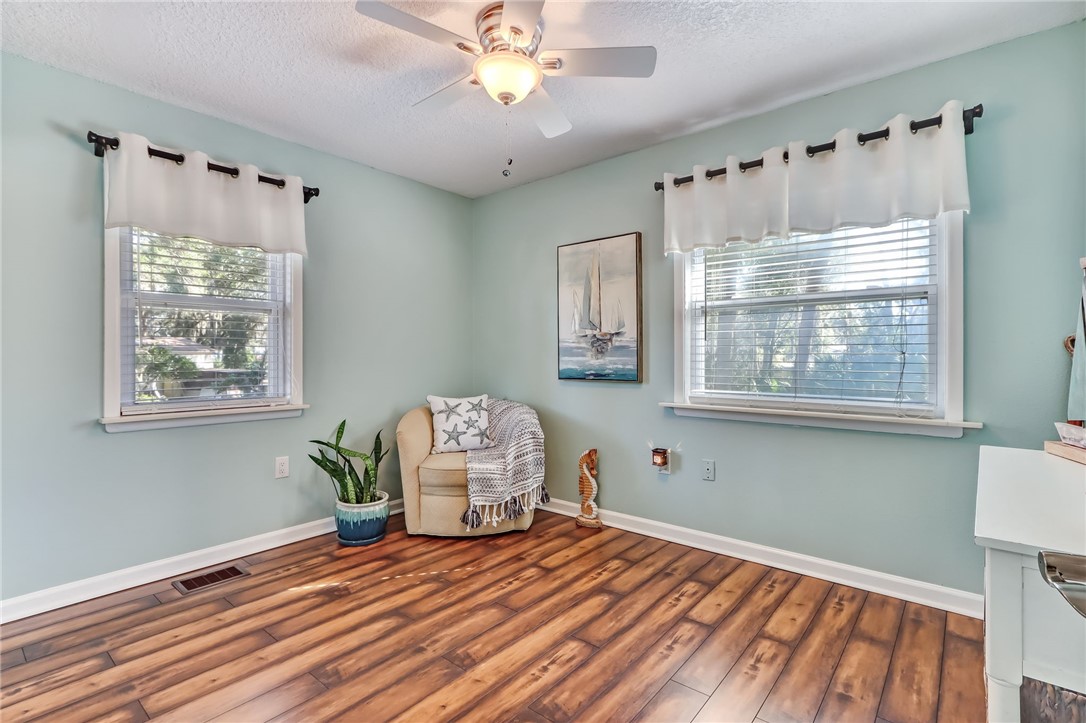 97253 Pirates Point Road Yulee, FL 32097 - Photo 11 of 34 a bedroom with furniture and a window