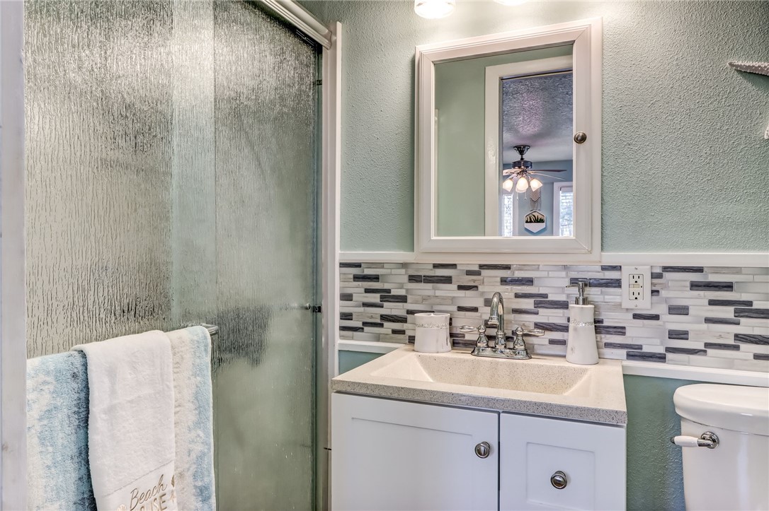 97253 Pirates Point Road Yulee, FL 32097 - Photo 16 of 34 a bathroom with a sink and a mirror