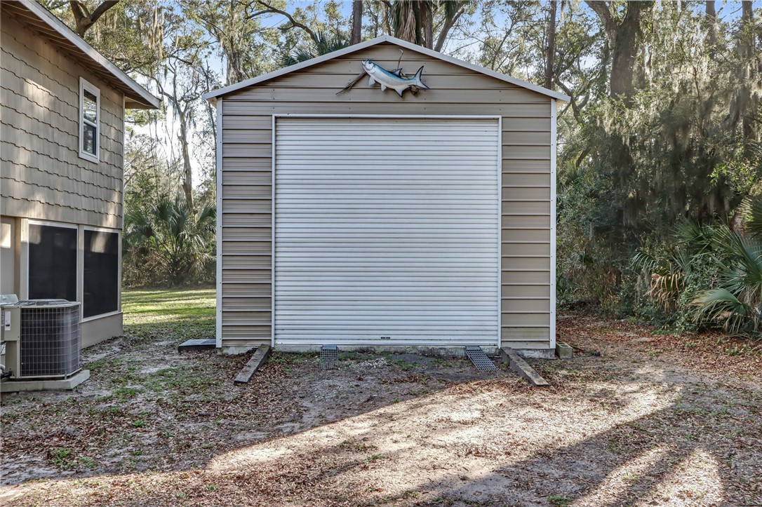 97253 Pirates Point Road Yulee, FL 32097 - Photo 2 of 34 a front view of a house with garden