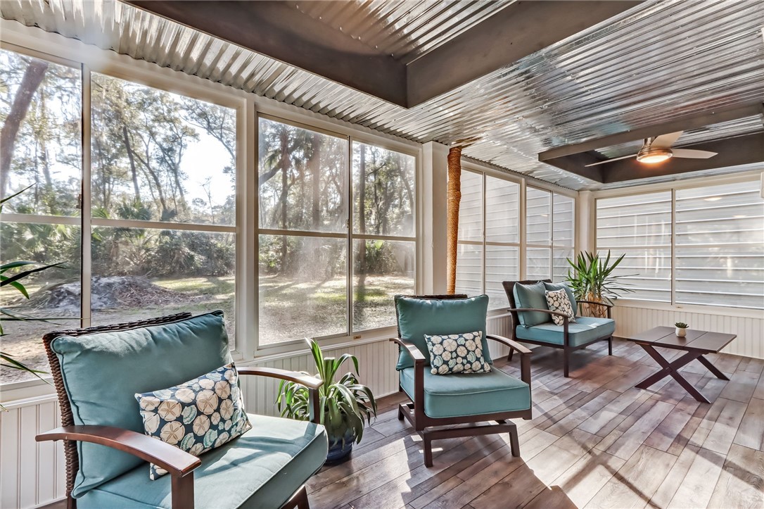 97253 Pirates Point Road Yulee, FL 32097 - Photo 24 of 34 a living room with furniture and a large window