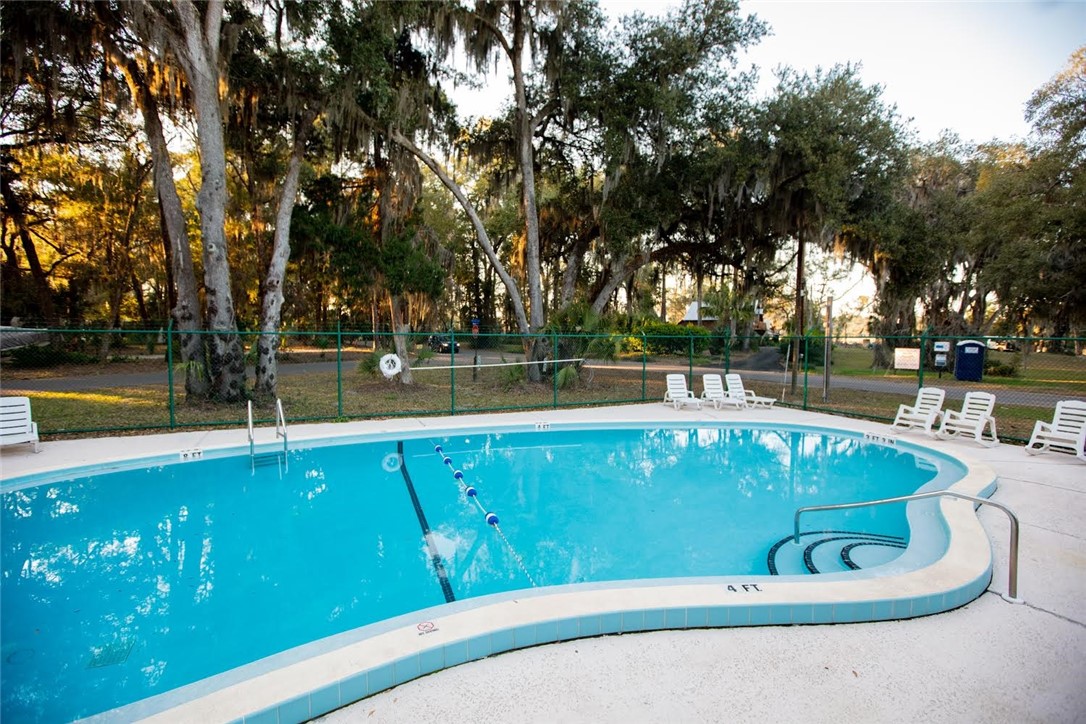 97253 Pirates Point Road Yulee, FL 32097 - Photo 33 of 34 a view of a swimming pool with a patio