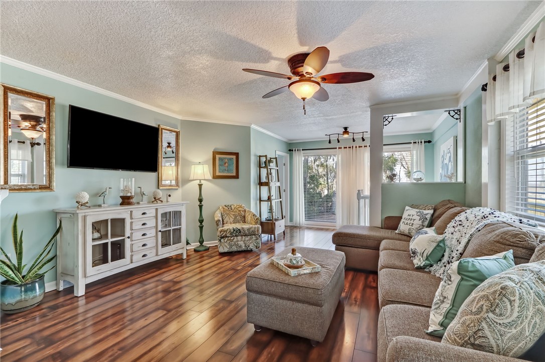 97253 Pirates Point Road Yulee, FL 32097 - Photo 8 of 34 a living room with furniture and a flat screen tv