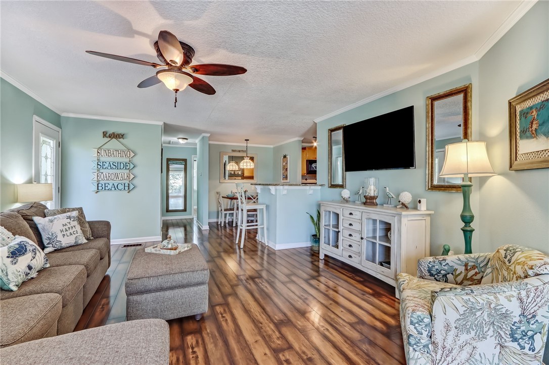 97253 Pirates Point Road Yulee, FL 32097 - Photo 10 of 34 a living room with furniture and a flat screen tv