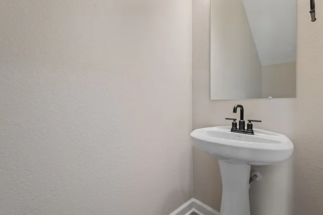 a white sink sitting next to a white sink