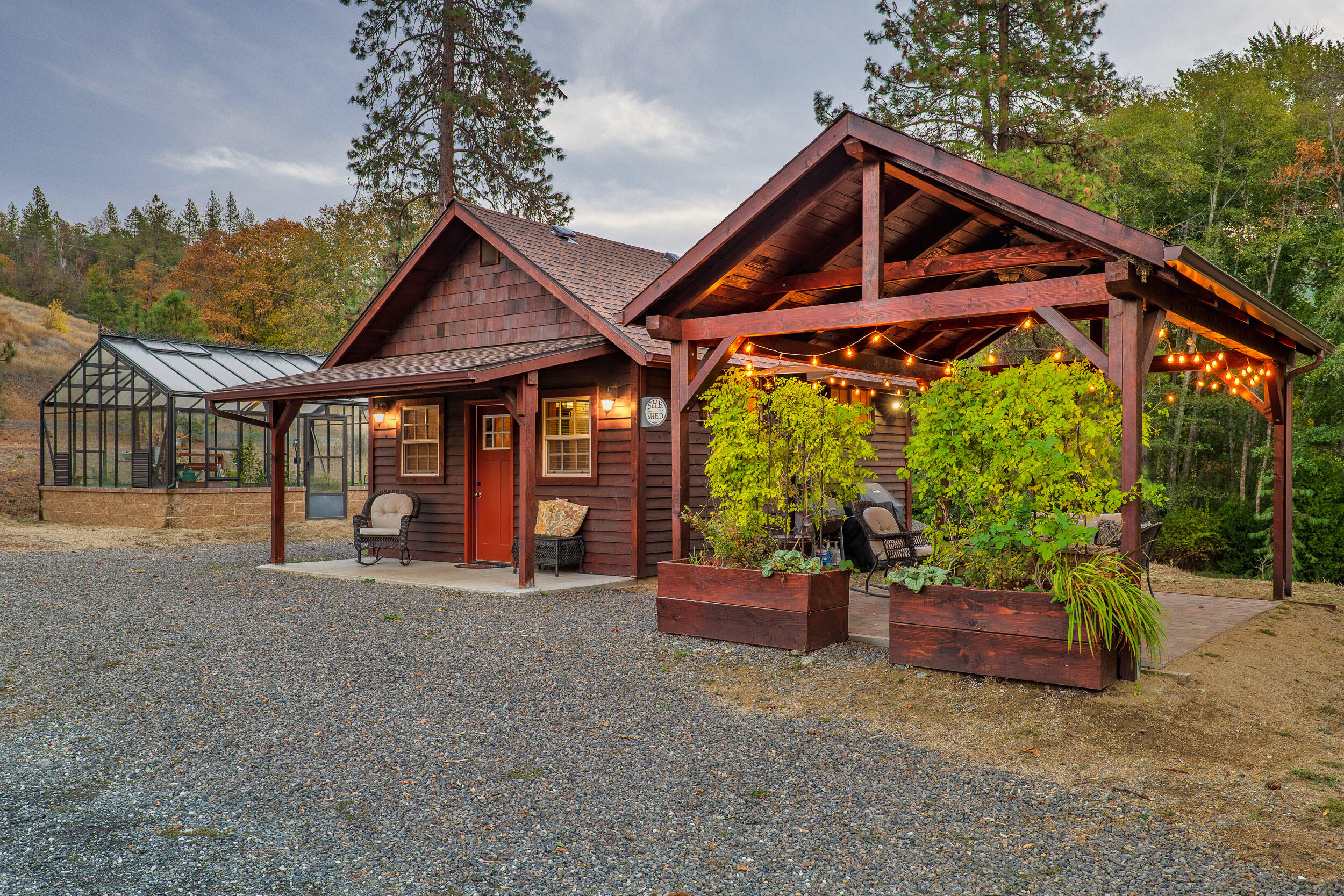 3732-3786 Little Applegate Road Jacksonville, OR 97530 - Photo 8 of 72 a front view of a house with porch and garden