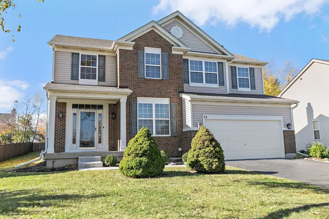 front view of a house with a yard