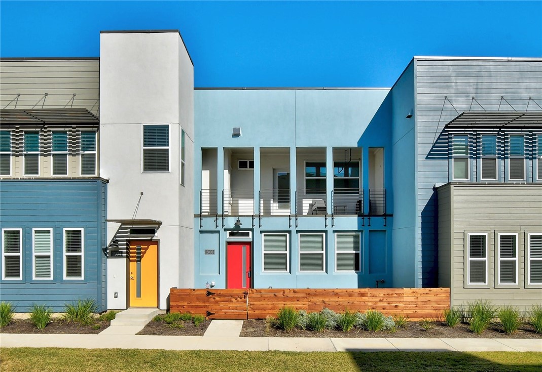 a front view of a building with a yard