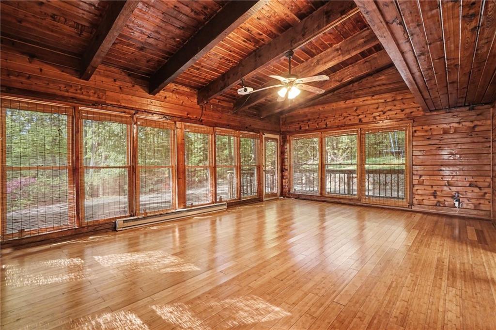 2530 Rockbridge Road Northwest Conyers, GA 30012 - Photo 29 of 45 a view of an empty room with wooden floor and a window