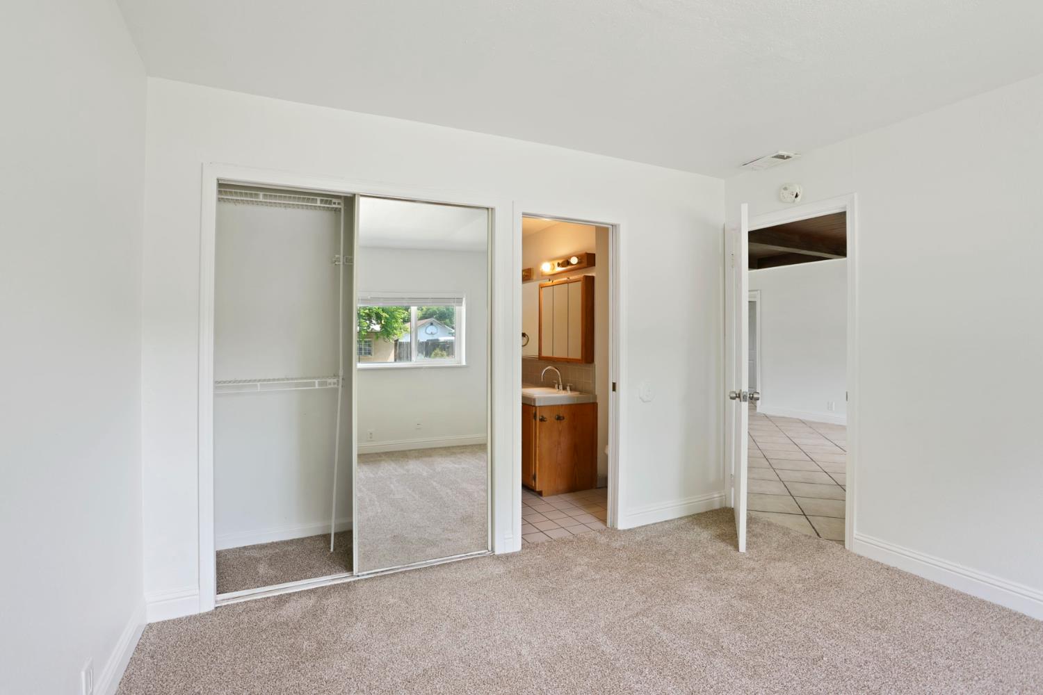 2452 Christina Avenue Stockton, CA 95204 - Photo 24 of 34 an empty room with closet and a hallway