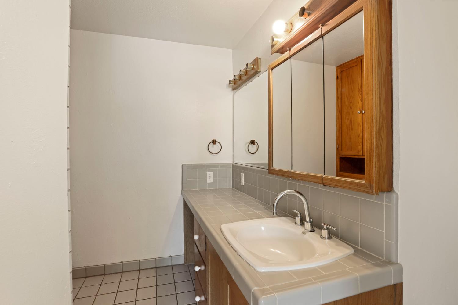2452 Christina Avenue Stockton, CA 95204 - Photo 25 of 34 a bathroom with a sink and a mirror