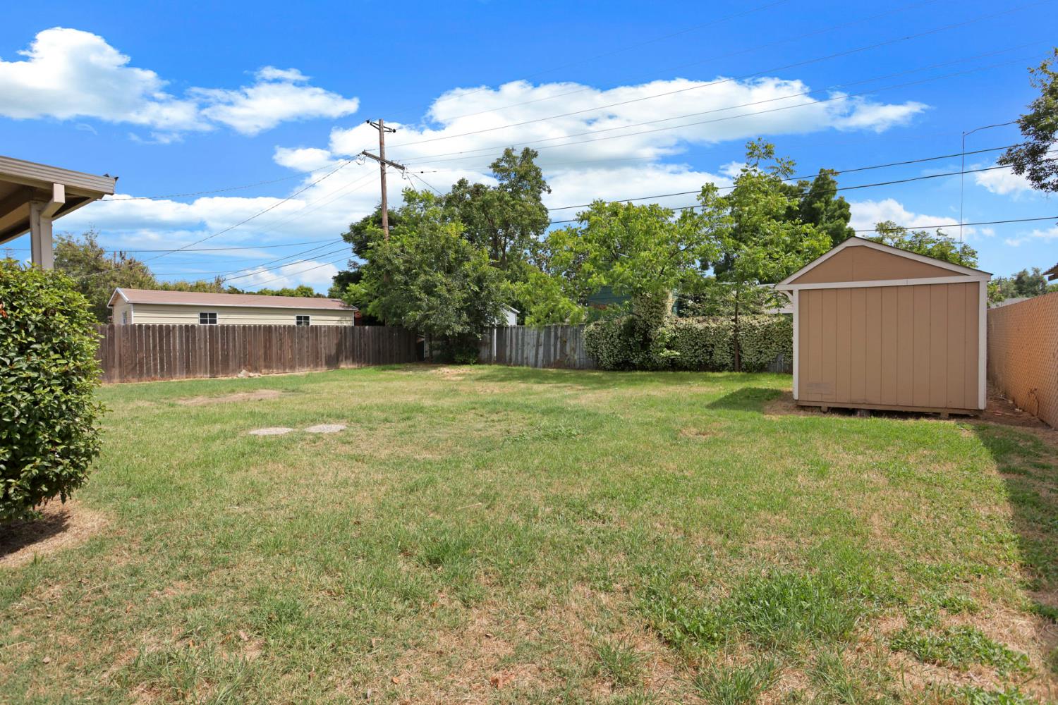 2452 Christina Avenue Stockton, CA 95204 - Photo 31 of 34 a view of a garden with a building in the background
