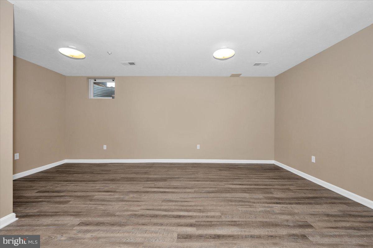 1184 Heathfield Road Sykesville, MD 21784 - Photo 31 of 56 a view of an empty room with wooden floor