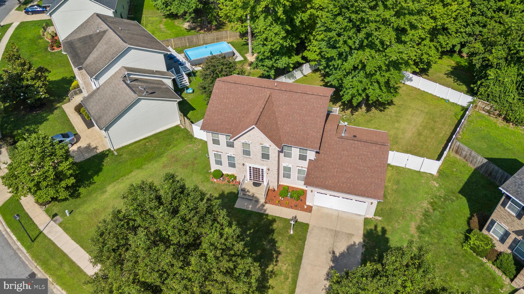 8910 Edison Lane Clinton, MD 20735 - Photo 2 of 51 an aerial view of residential house with outdoor space and trees all around