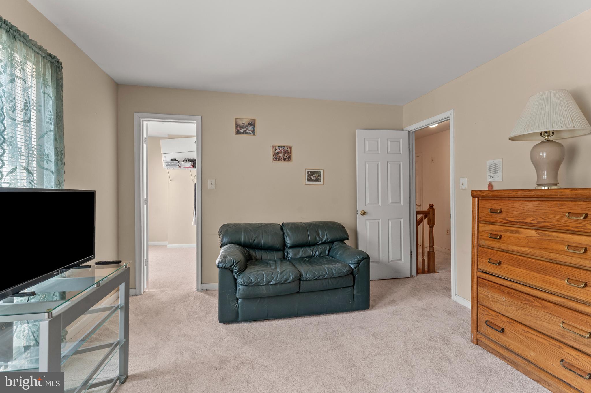8910 Edison Lane Clinton, MD 20735 - Photo 23 of 51 a living room with furniture and a flat screen tv