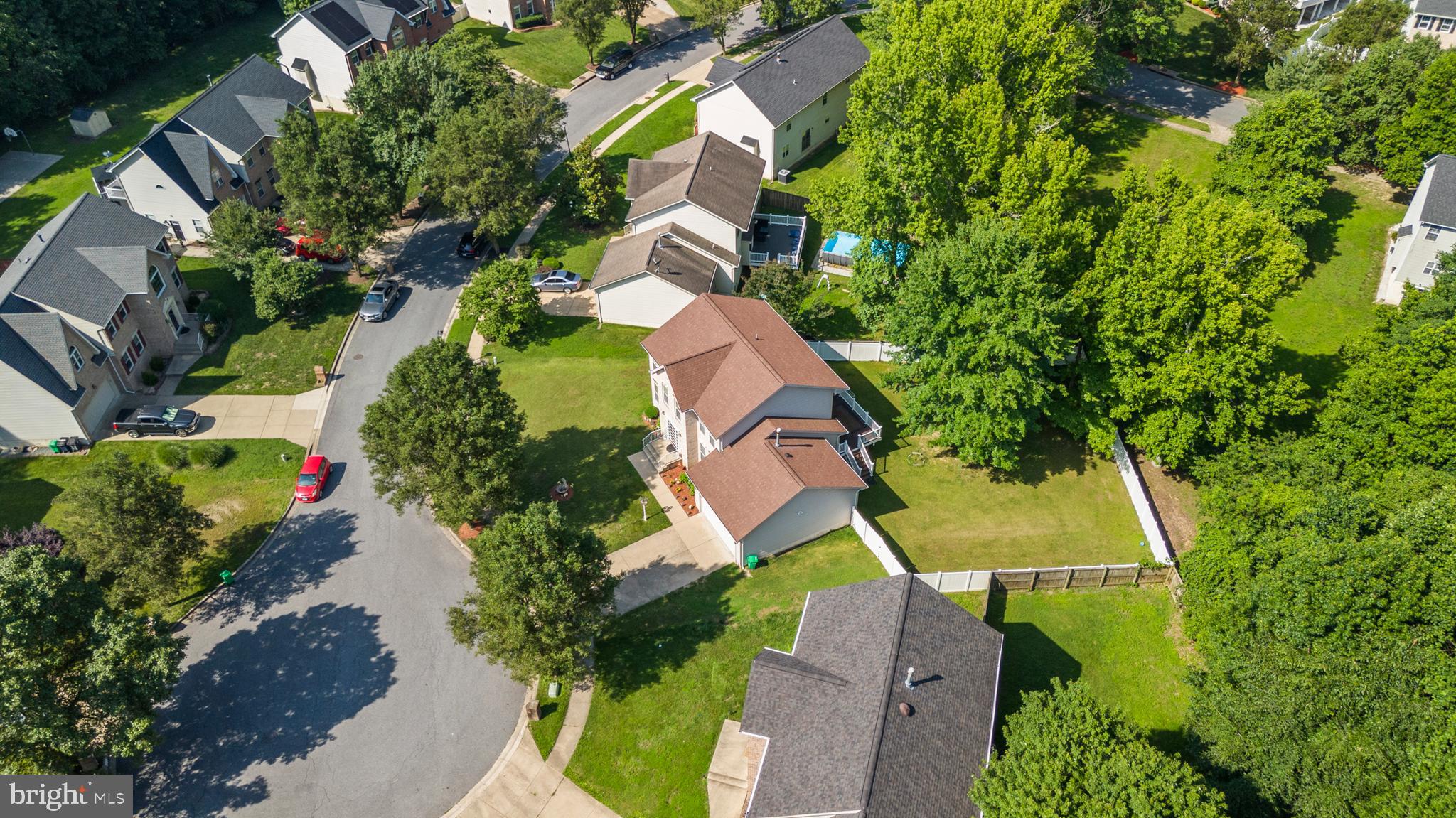 8910 Edison Lane Clinton, MD 20735 - Photo 5 of 51 an aerial view of residential house with outdoor space and trees all around