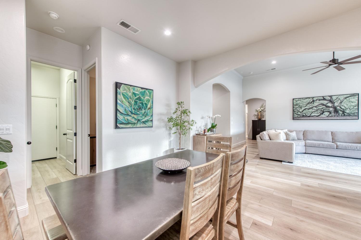 1674 North Cindy Avenue Clovis, CA 93619 - Photo 13 of 46 a view of a dining room with furniture and wooden floor