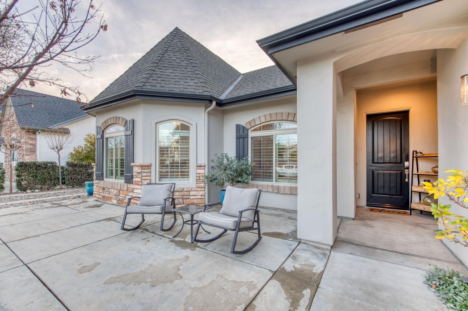 1674 North Cindy Avenue Clovis, CA 93619 - Photo 2 of 46 a building outdoor space with patio furniture and potted plants