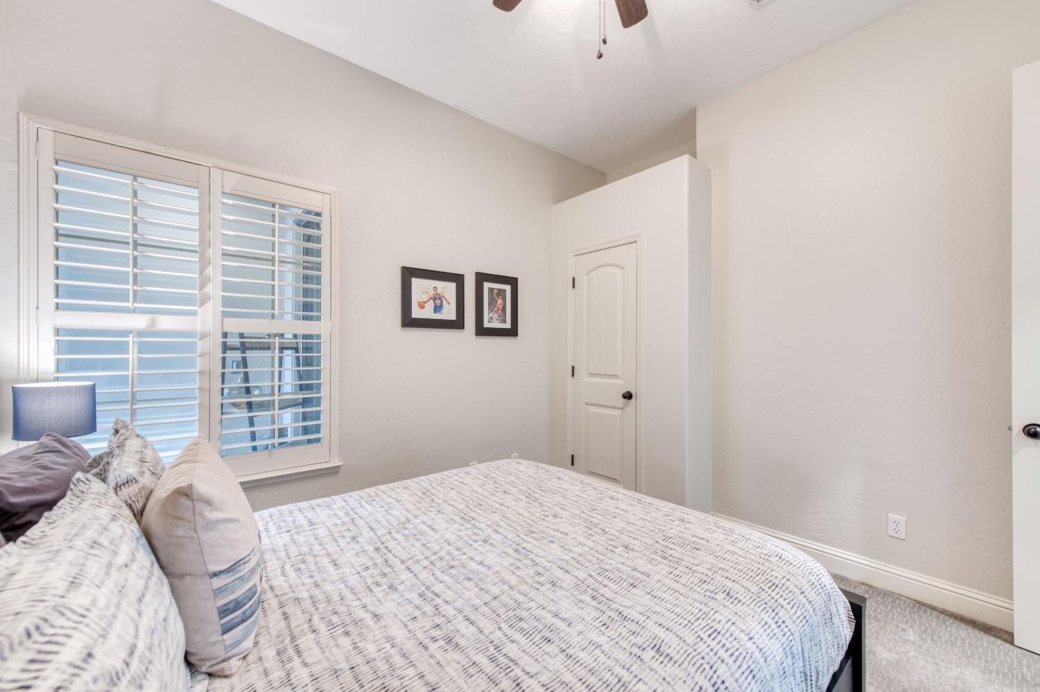 1674 North Cindy Avenue Clovis, CA 93619 - Photo 22 of 46 a bedroom with a bed and a window