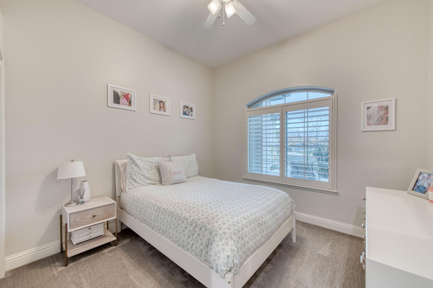 1674 North Cindy Avenue Clovis, CA 93619 - Photo 23 of 46 a bedroom with a bed and a window