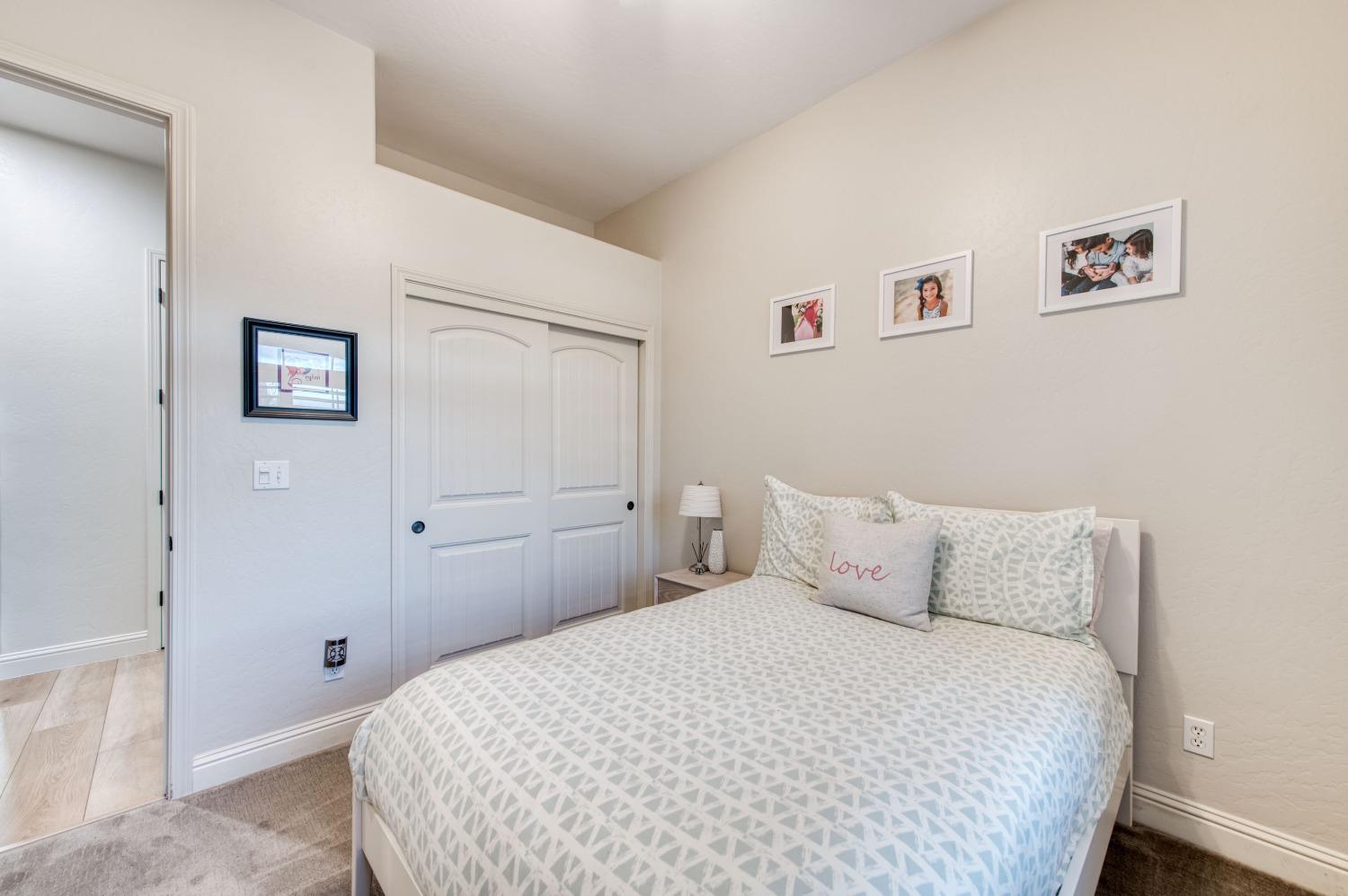 1674 North Cindy Avenue Clovis, CA 93619 - Photo 24 of 46 a bedroom with a bed and wall painting