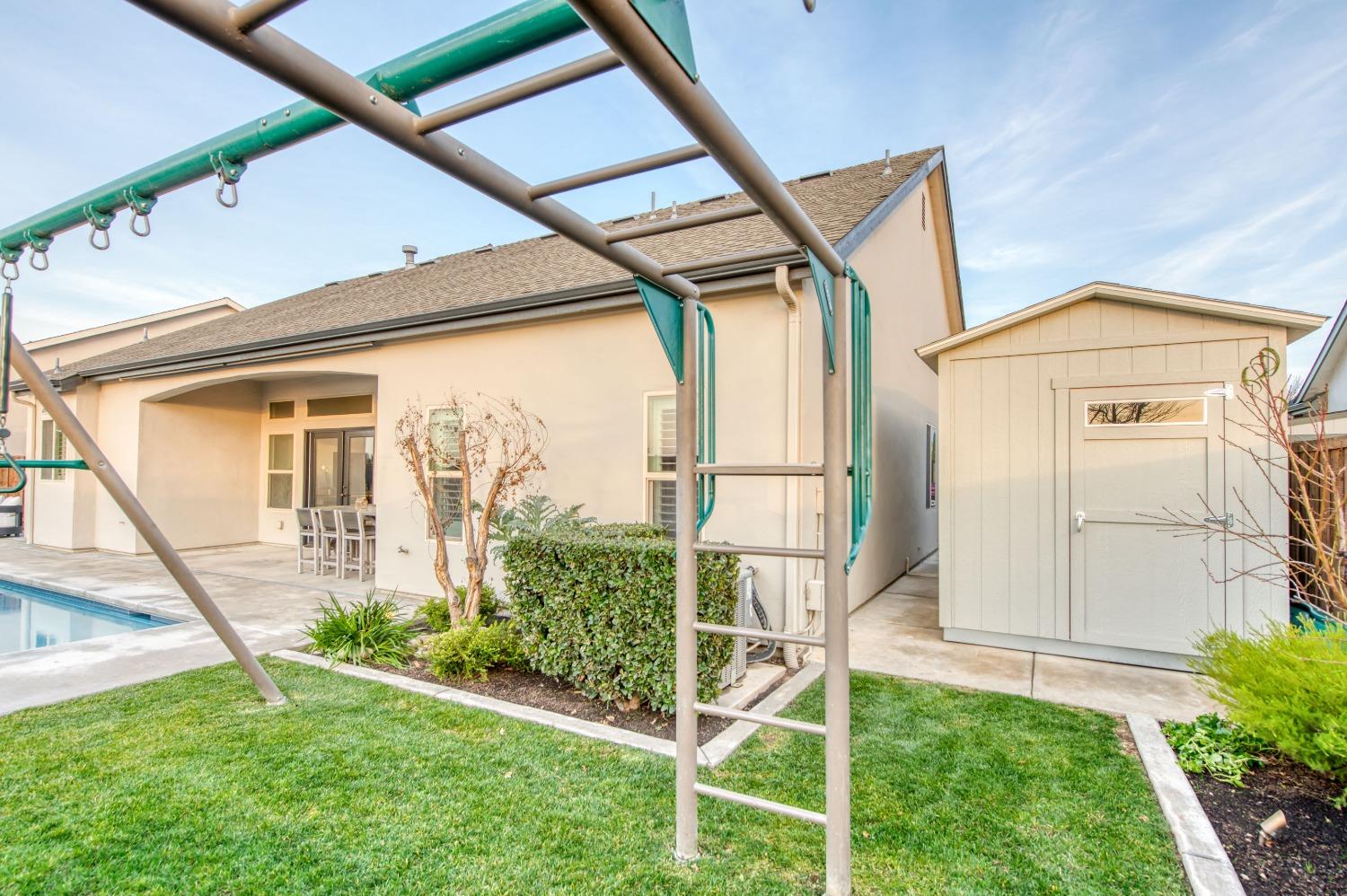 1674 North Cindy Avenue Clovis, CA 93619 - Photo 31 of 46 a view of an house with backyard and garden