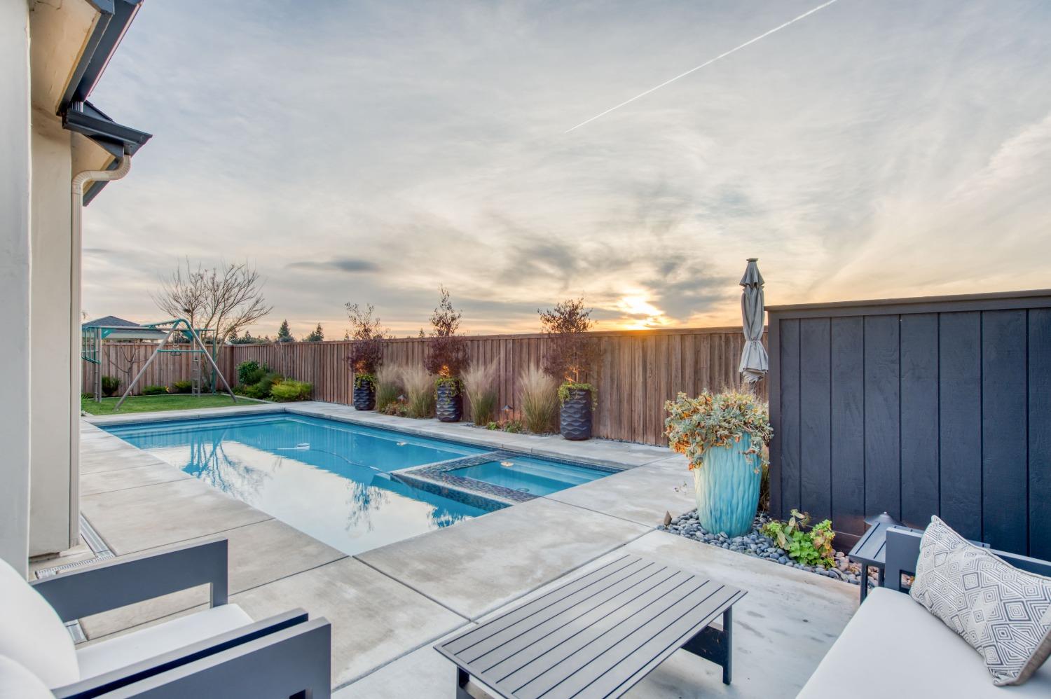 1674 North Cindy Avenue Clovis, CA 93619 - Photo 36 of 46 a view of a backyard and swimming pool