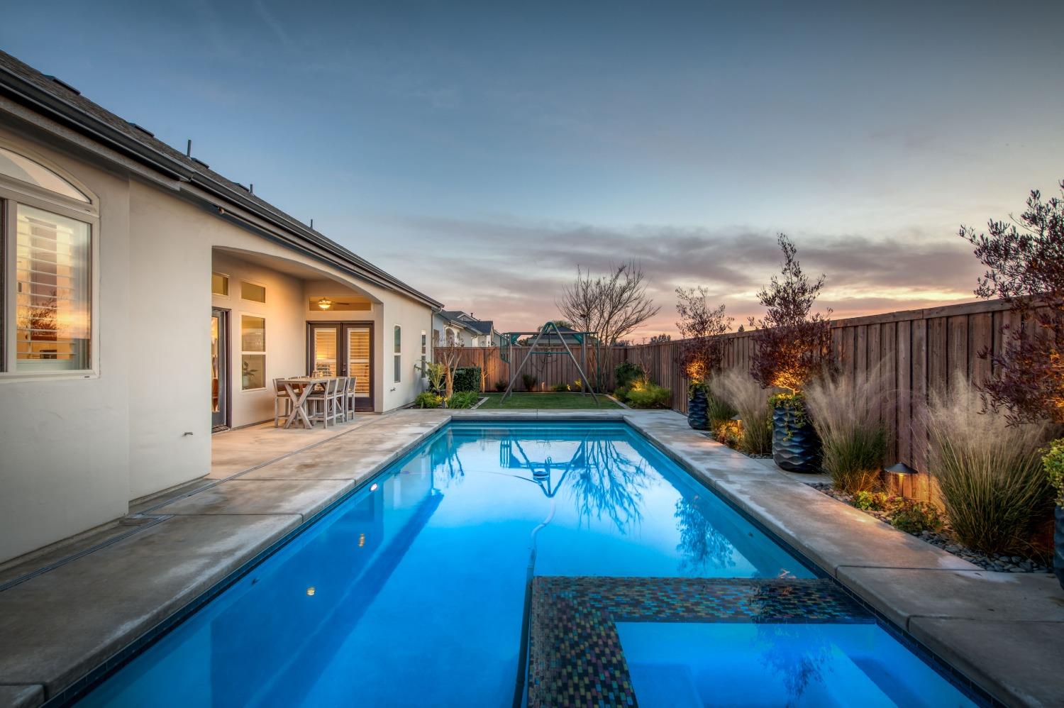 1674 North Cindy Avenue Clovis, CA 93619 - Photo 40 of 46 a view of a swimming pool with a patio
