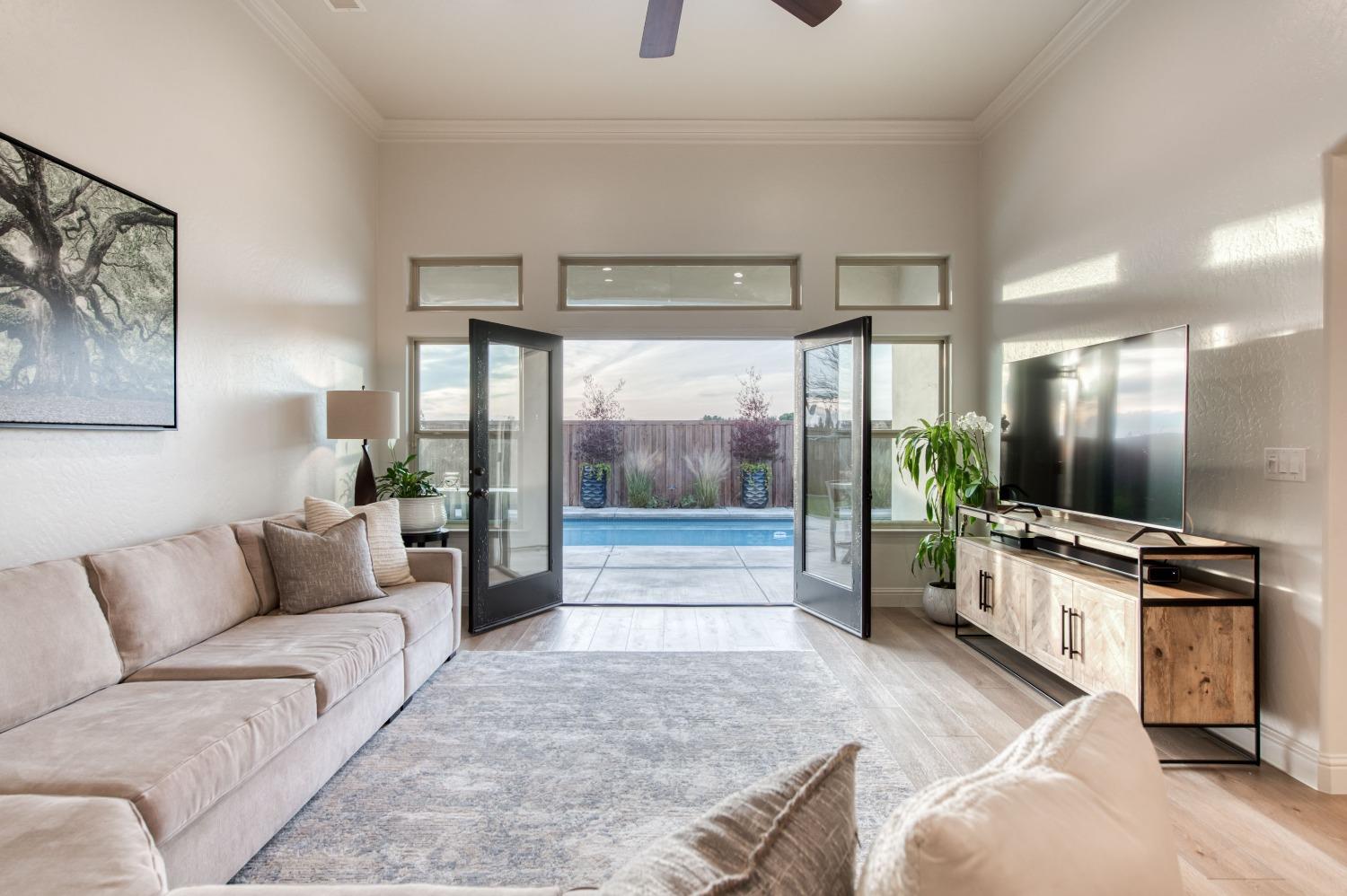 1674 North Cindy Avenue Clovis, CA 93619 - Photo 4 of 46 a living room with furniture and a flat screen tv