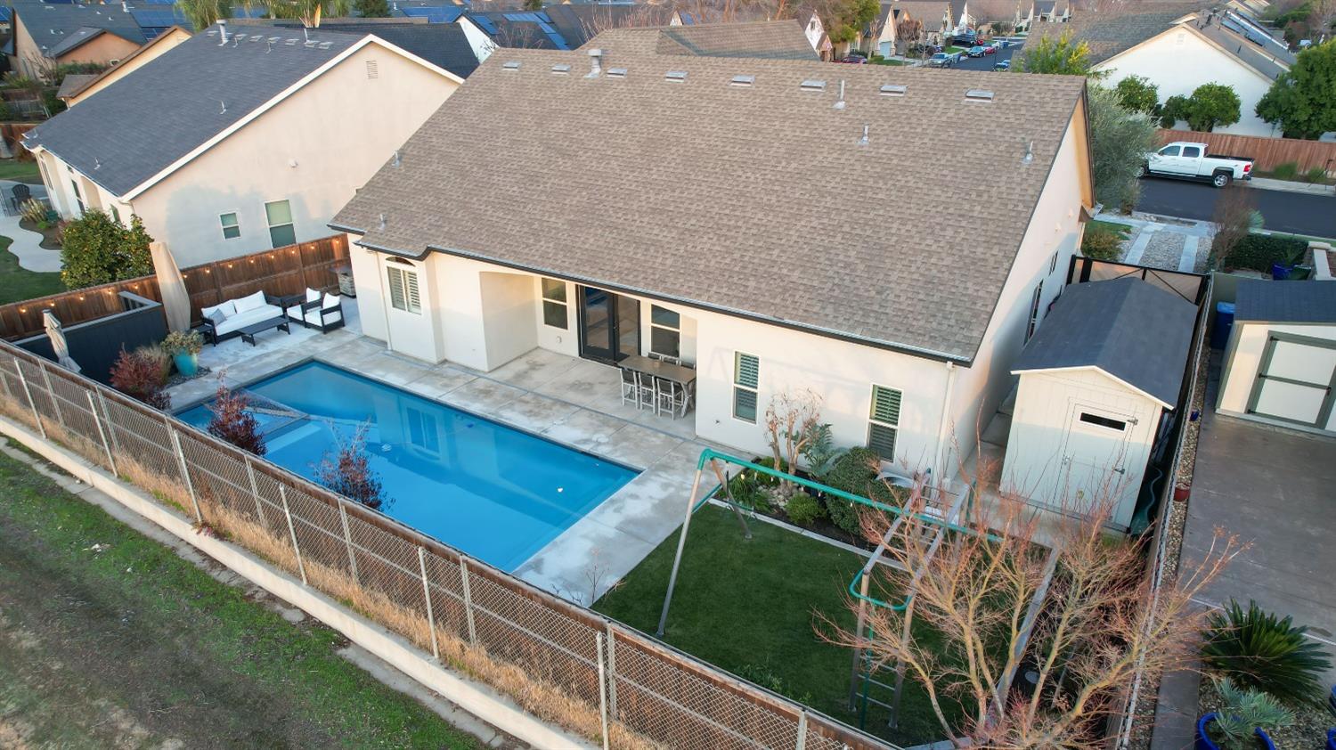 1674 North Cindy Avenue Clovis, CA 93619 - Photo 42 of 46 an aerial view of a house with deck and yard