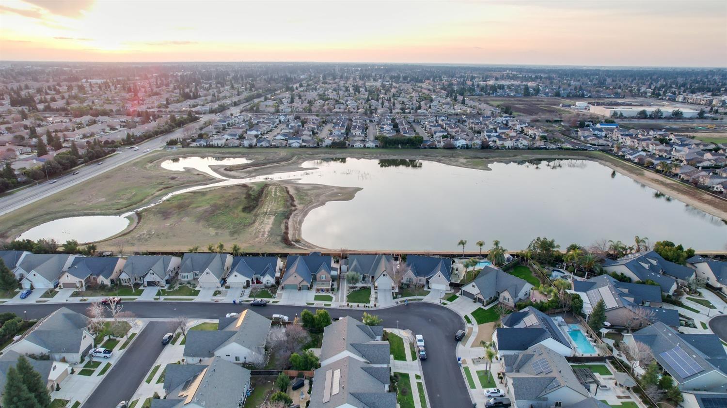 1674 North Cindy Avenue Clovis, CA 93619 - Photo 44 of 46 an aerial view of residential building and lake view