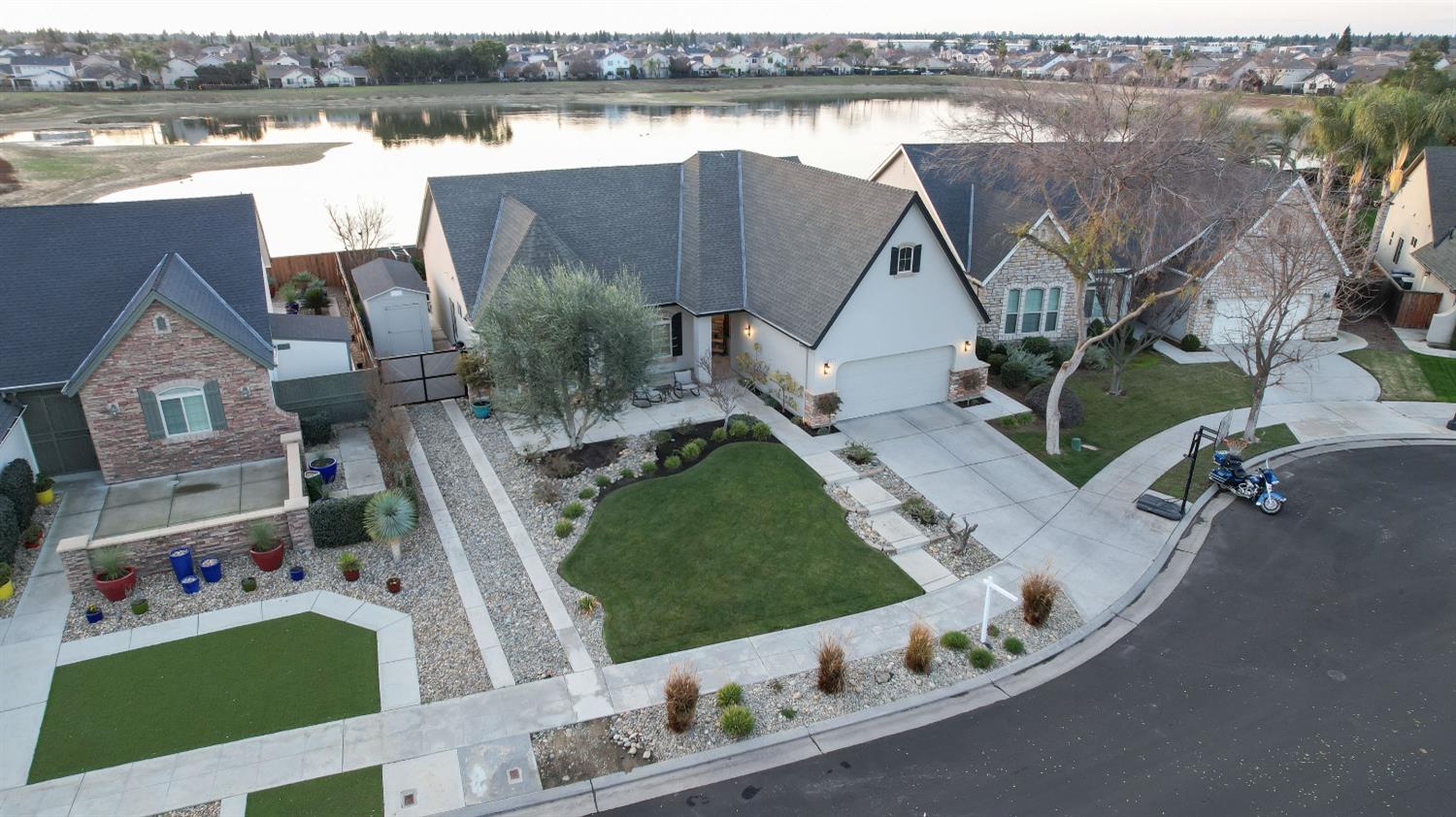 1674 North Cindy Avenue Clovis, CA 93619 - Photo 45 of 46 an aerial view of a house with a yard and lake view