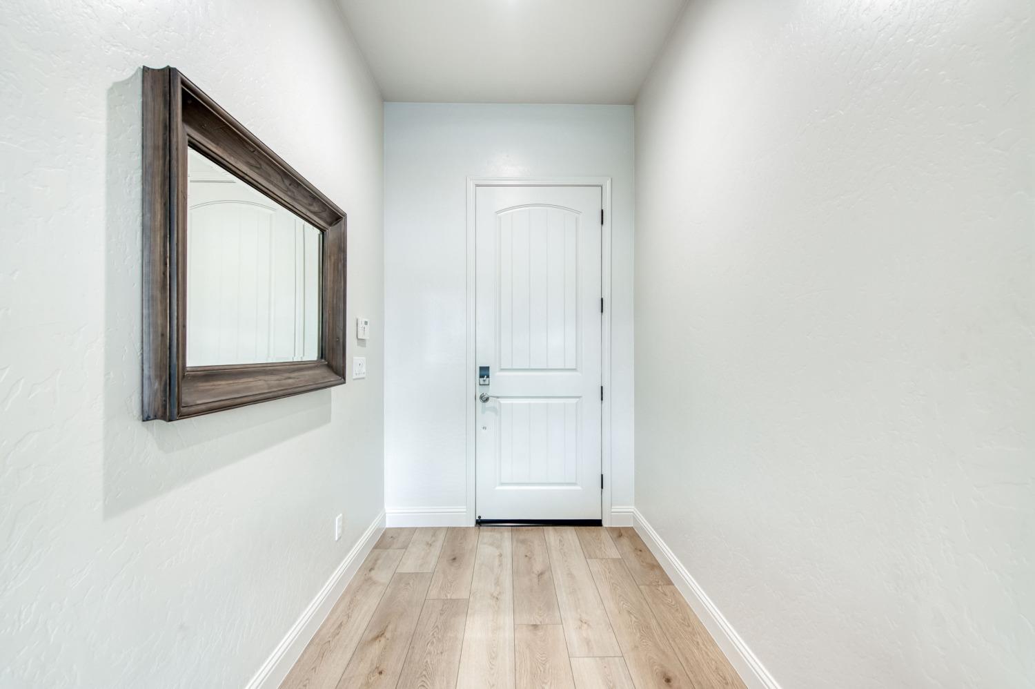 1674 North Cindy Avenue Clovis, CA 93619 - Photo 8 of 46 a view of a small space with wooden floor and closet