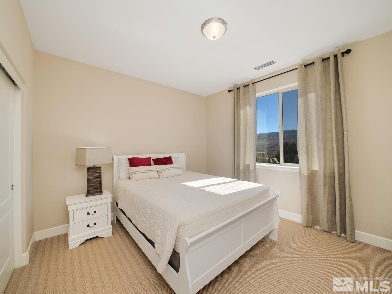 9050 Sydmesa Drive Reno, NV 89523 - Photo 15 of 23 a large white bed in a white room