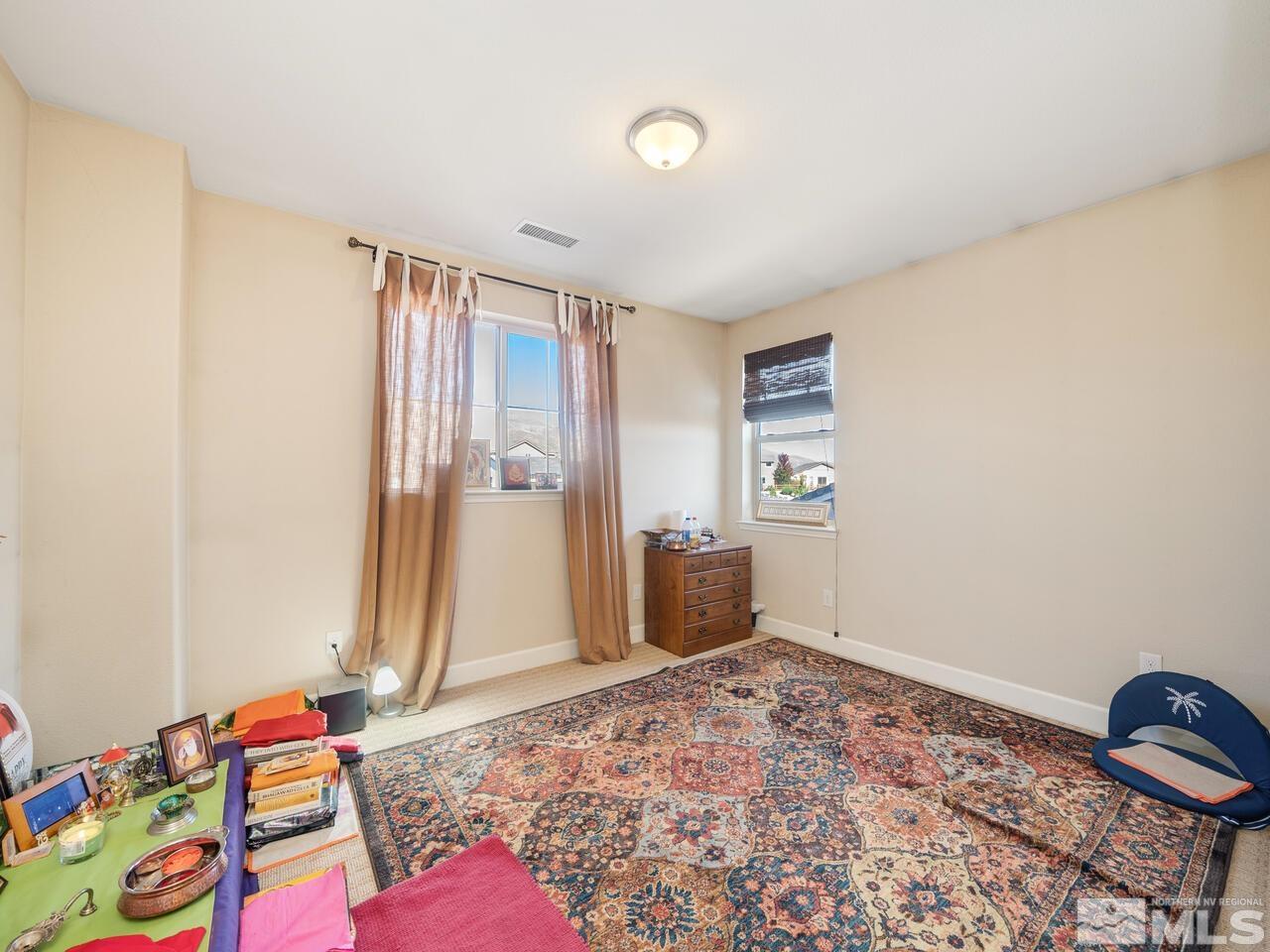9050 Sydmesa Drive Reno, NV 89523 - Photo 17 of 23 a bedroom with a bed and a window