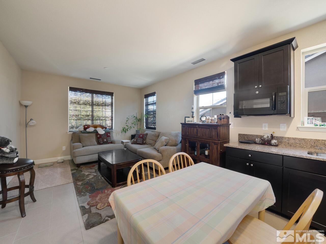 9050 Sydmesa Drive Reno, NV 89523 - Photo 18 of 23 a view of a dining room with furniture and window