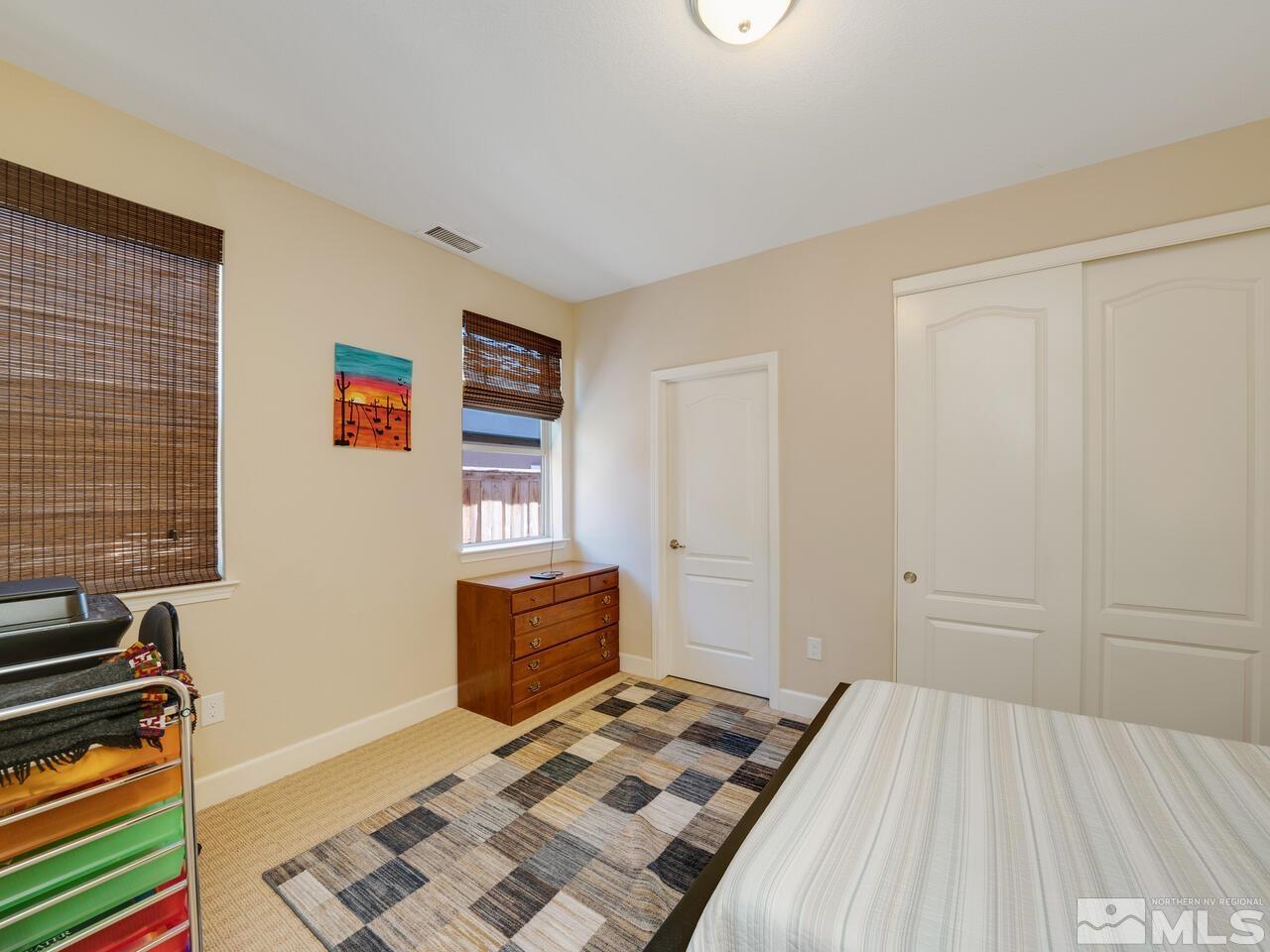9050 Sydmesa Drive Reno, NV 89523 - Photo 20 of 23 a bedroom with a bed and a window
