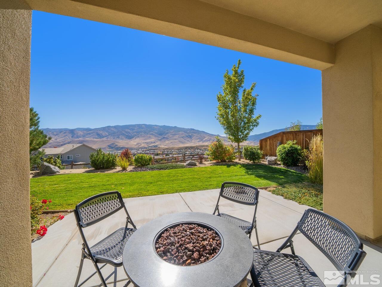 9050 Sydmesa Drive Reno, NV 89523 - Photo 2 of 23 a view of a chairs and table in the patio