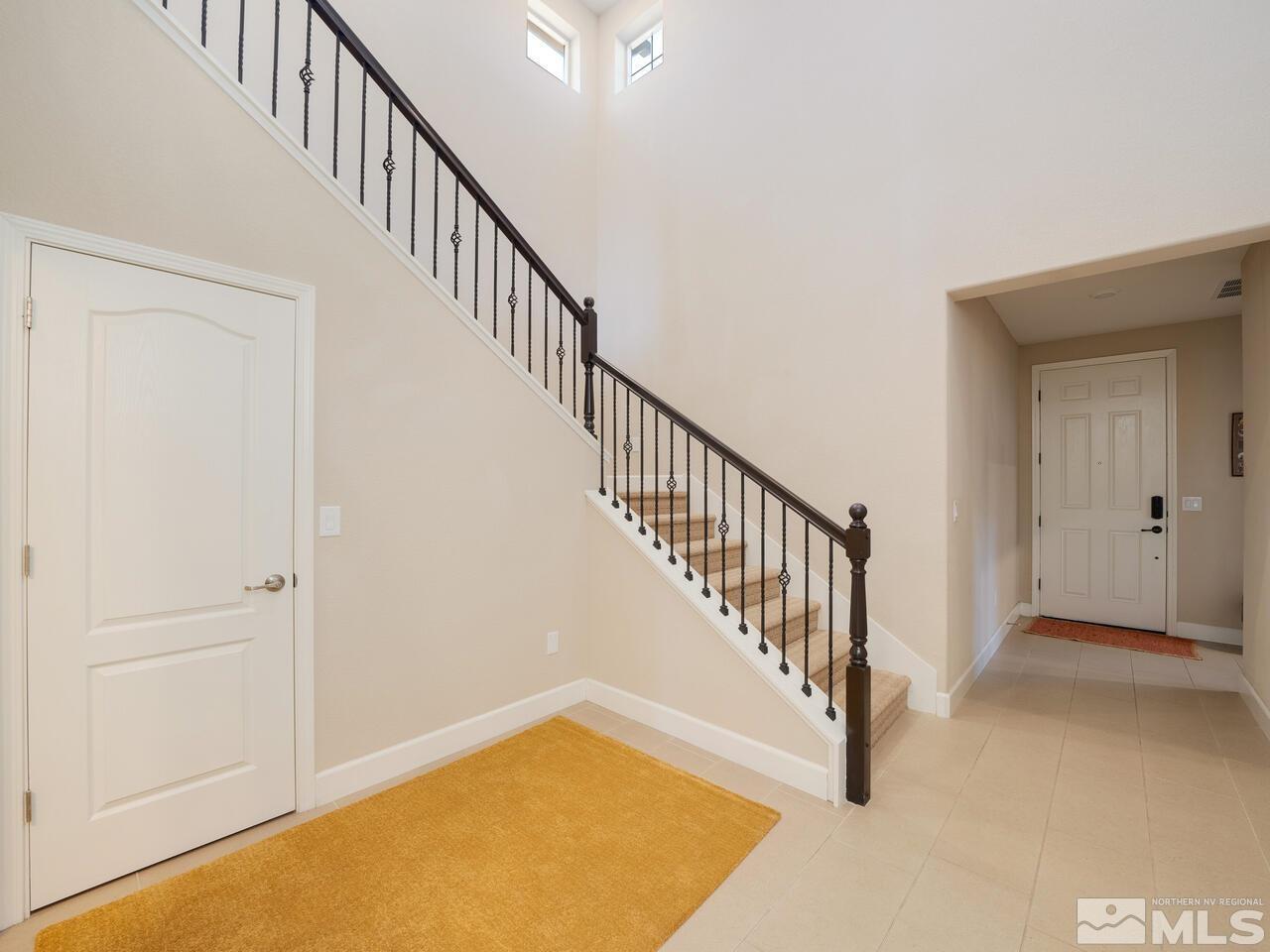 9050 Sydmesa Drive Reno, NV 89523 - Photo 4 of 23 a view of a hallway with staircase