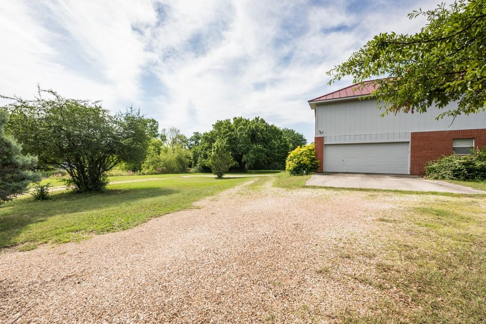 9554 David Fort Road Argyle, TX 76226 - Photo 3 of 35 a view of a house with a yard and garage