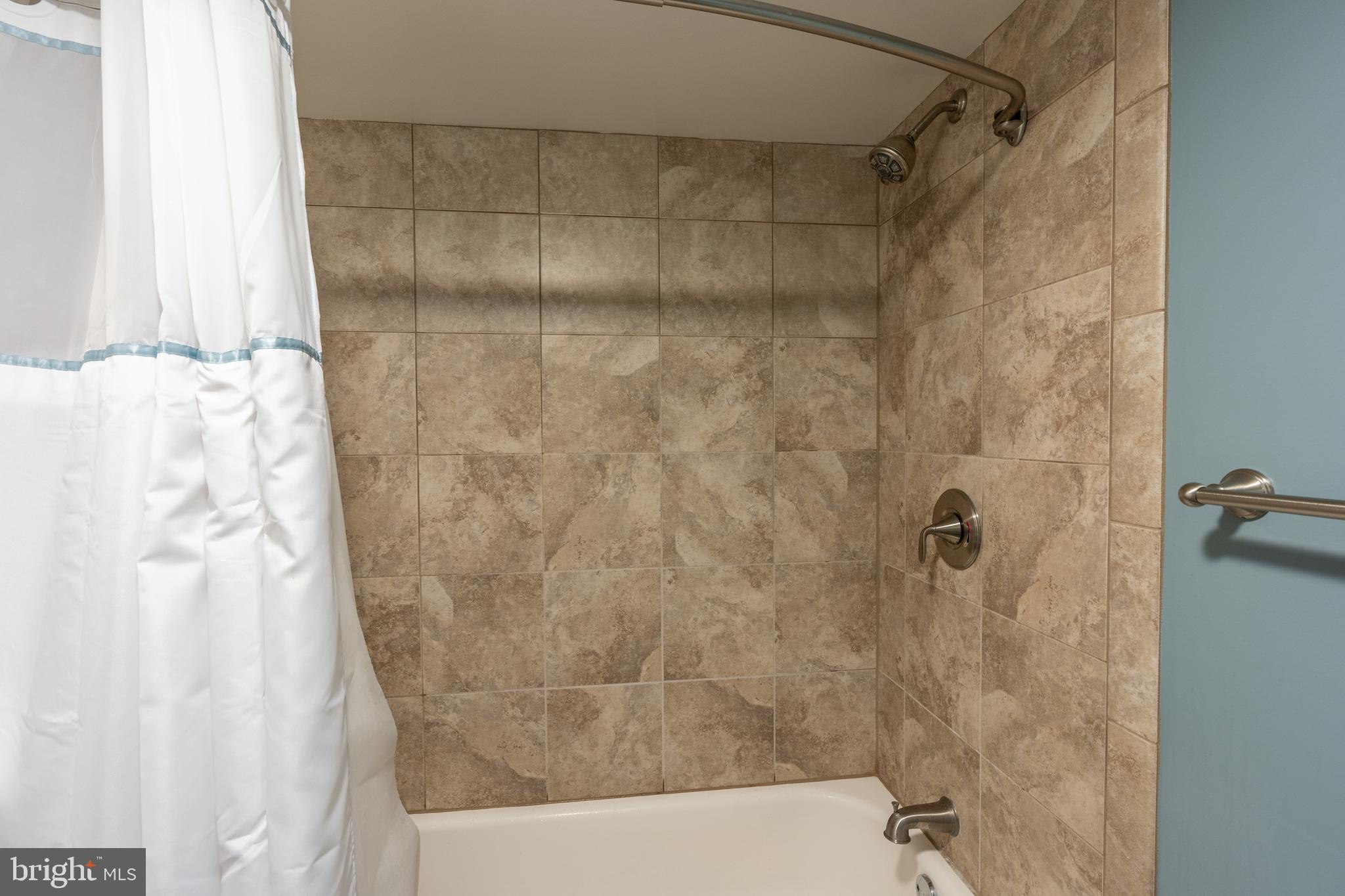 424 Whitestone Road Silver Spring, MD 20901 - Photo 30 of 42 Tub and shower in lower level full bath