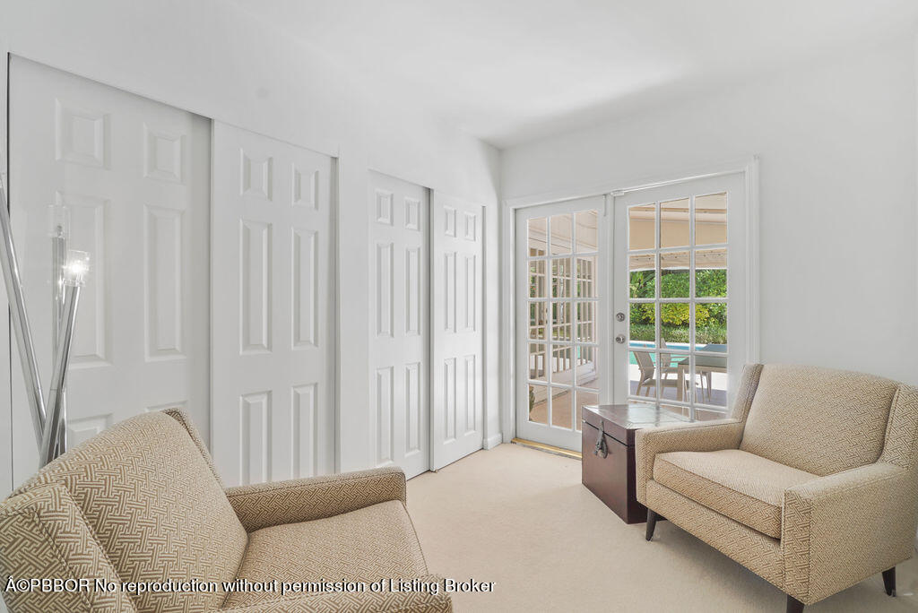 257 Fairview Road Palm Beach, FL 33480 - Photo 11 of 30 a living room with furniture and a large window