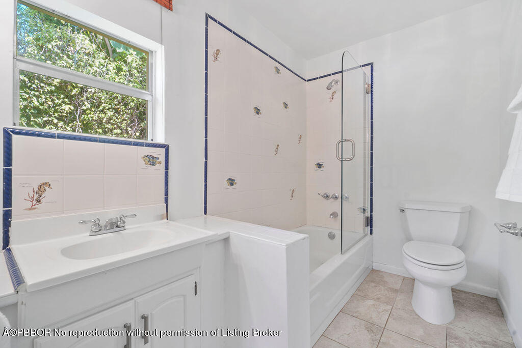 257 Fairview Road Palm Beach, FL 33480 - Photo 15 of 30 a bathroom with a sink a toilet and shower